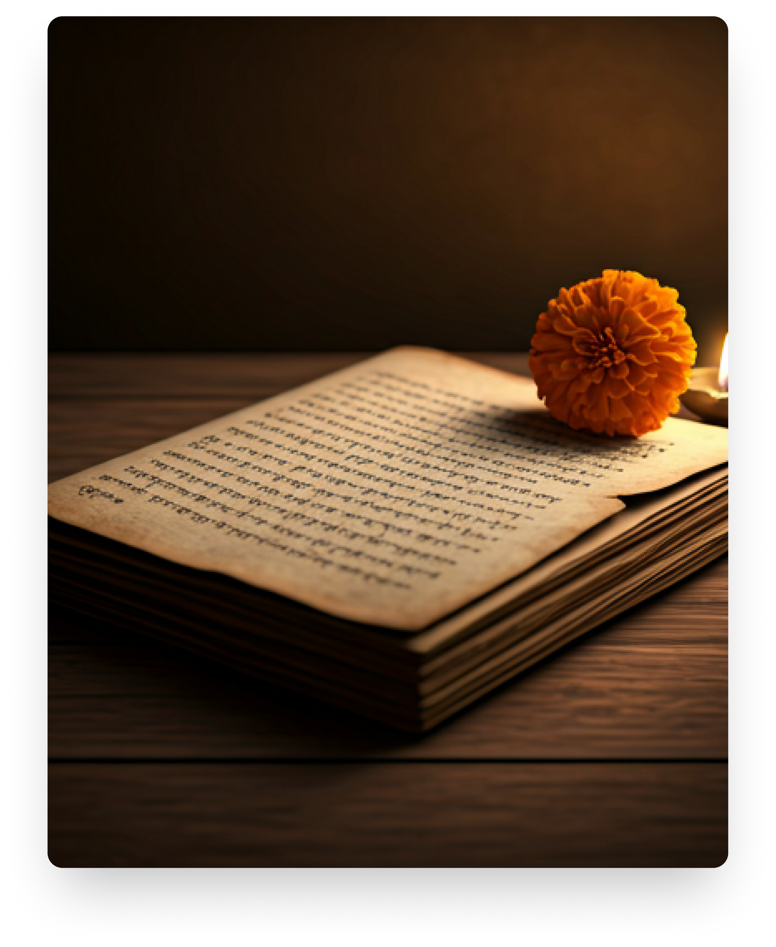 An open antique book resting on a wooden table beside a dried flower